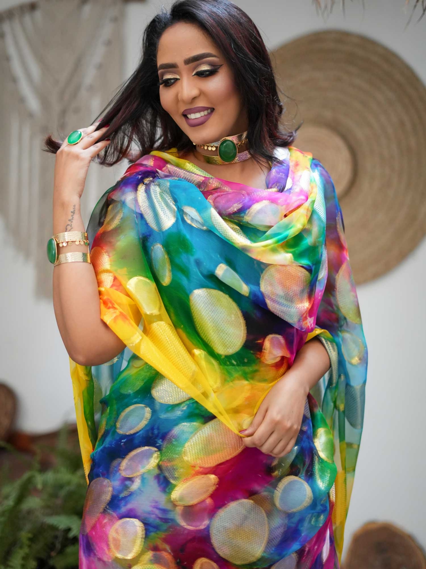 Woman wearing a colourful Sudanese Tobe