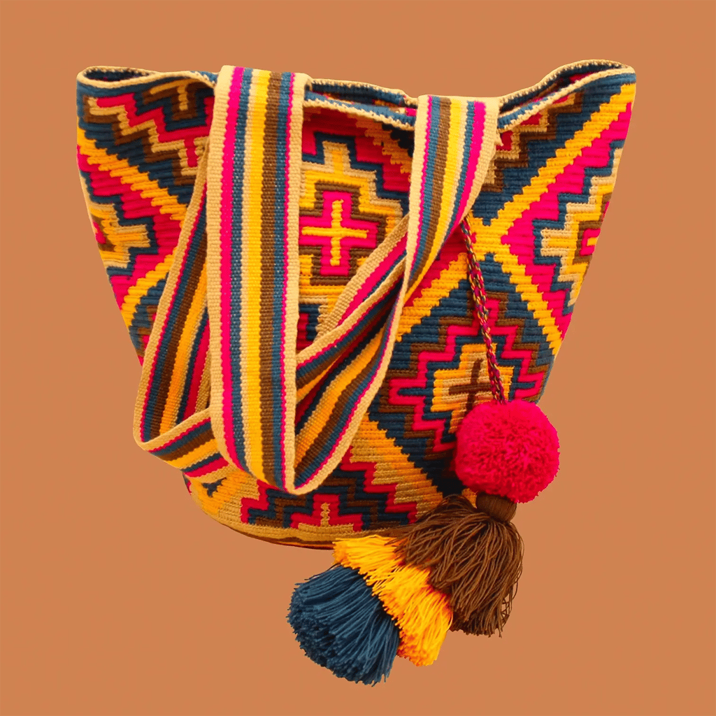 Sac bandoulière mochila femme et homme, tissé à la main par des tisserandes de la communauté Wayuu en Colombie. Issu d'une mode éthique et slow-fashion.
