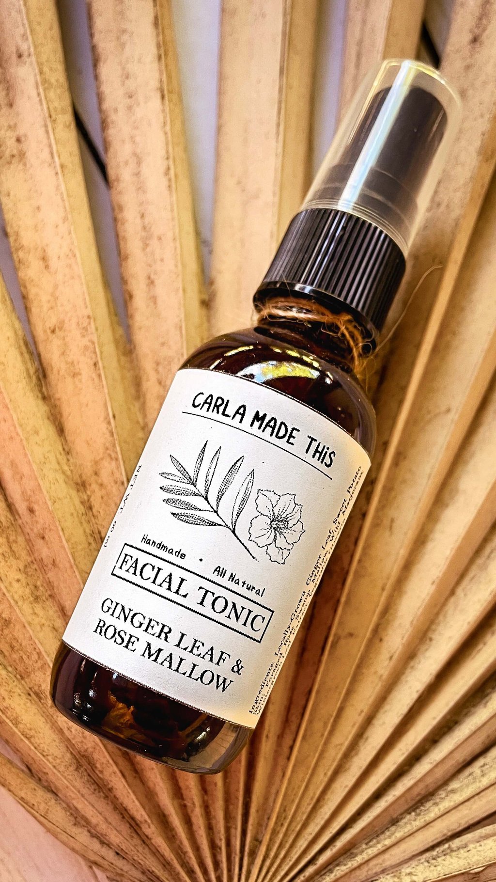 Spray bottle of ginger leaf and rose mallow facial tonic