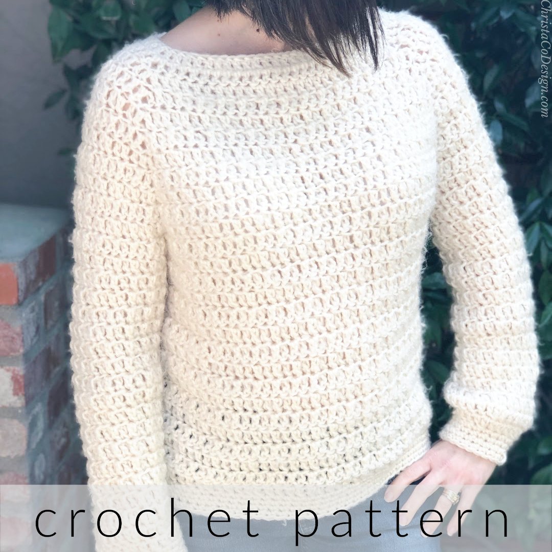 Woman in chunky cream crochet sweater.