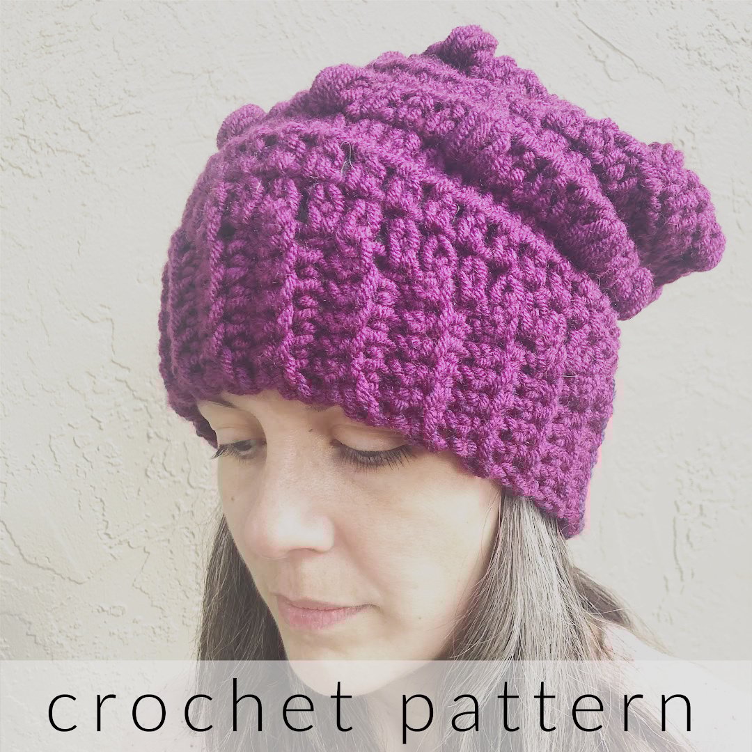  Woman with chunky slouchy hat on in purple.