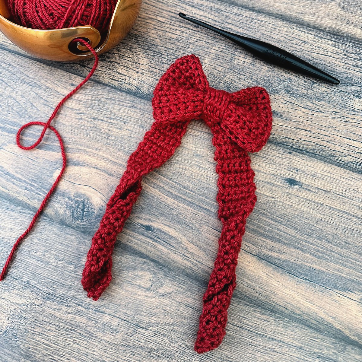 Red crochet Christmas bow.
