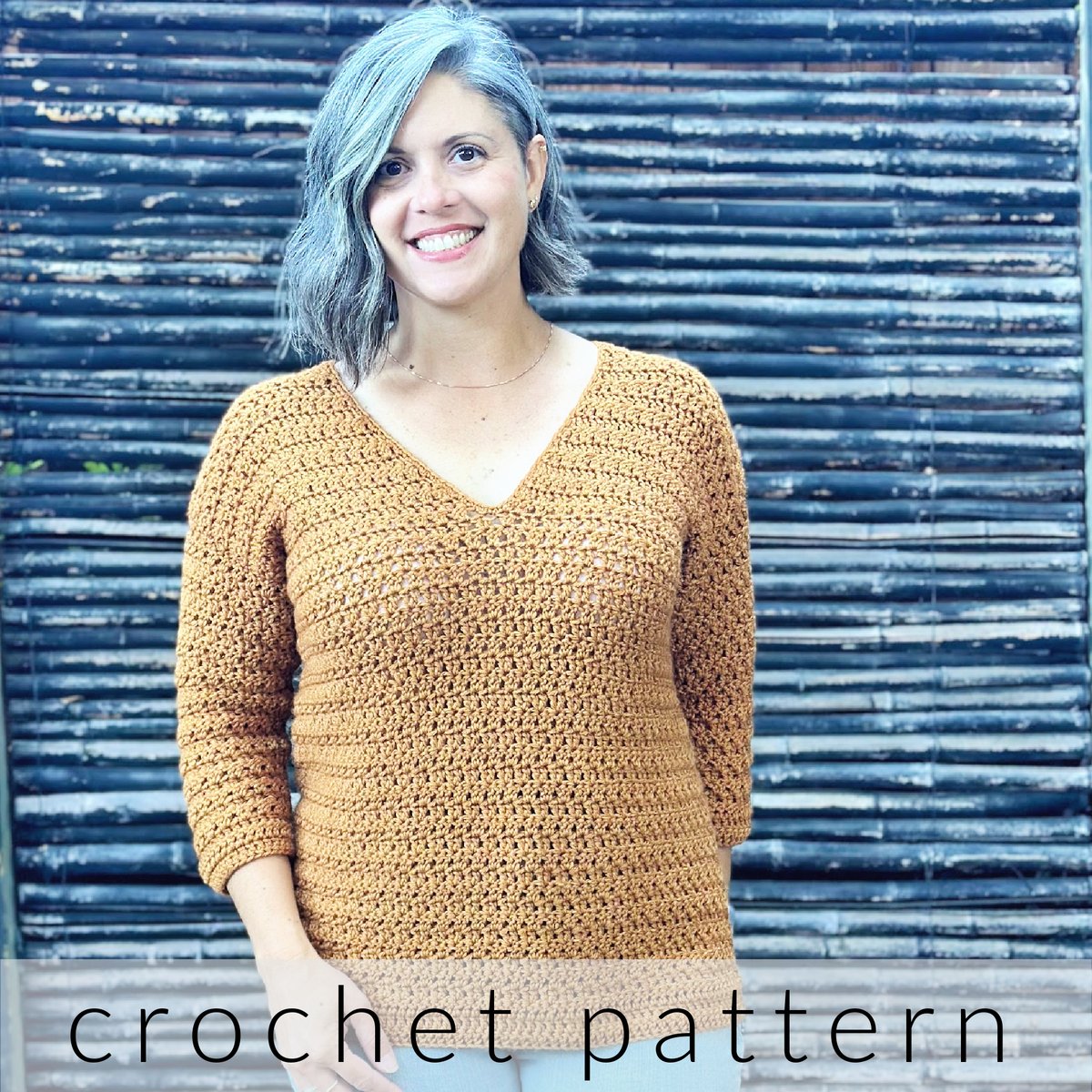 Woman smiling in crochet sweater with v-neck and 3/4 sleeves.