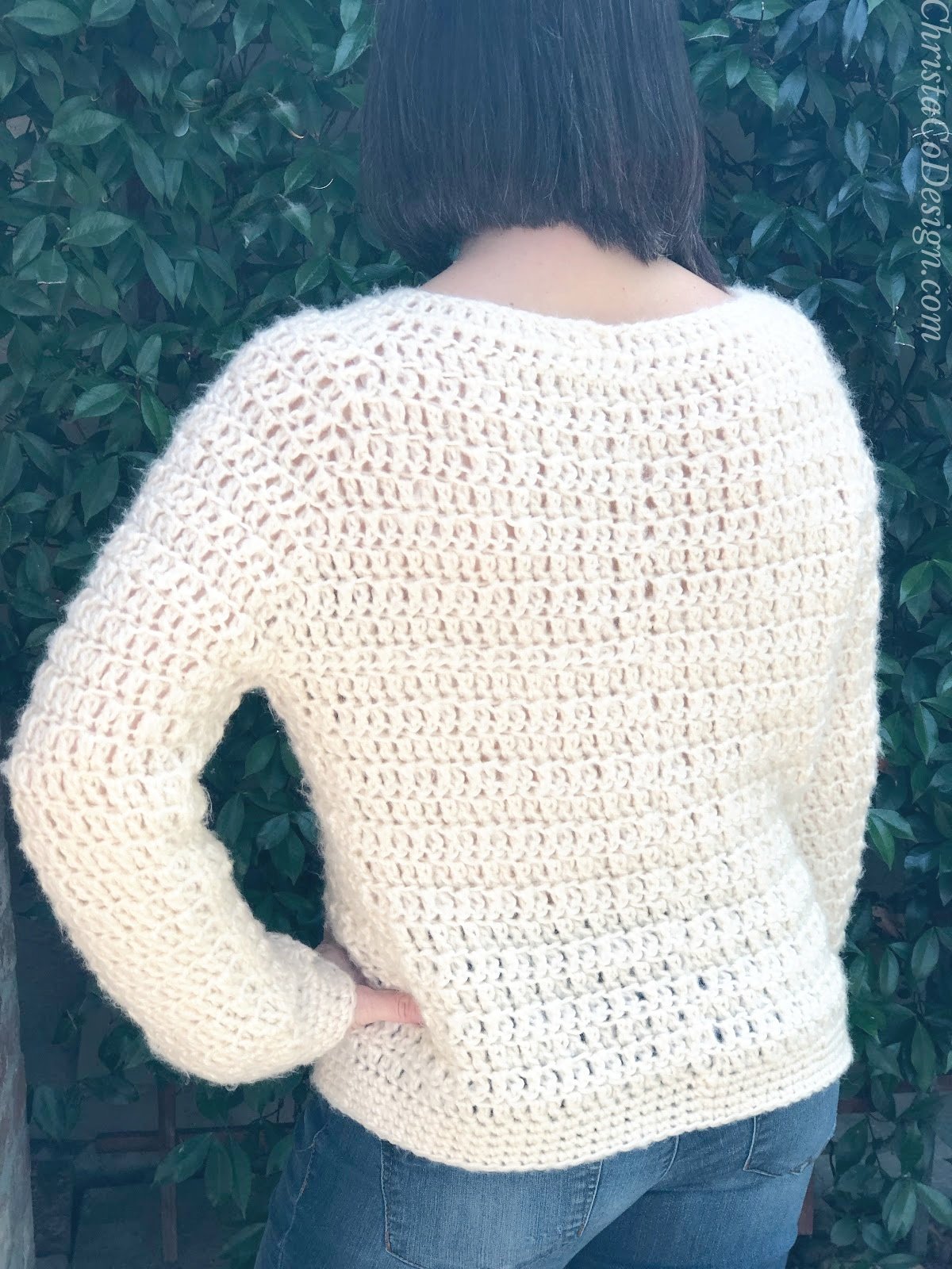 Back view of crochet sweater on woman.