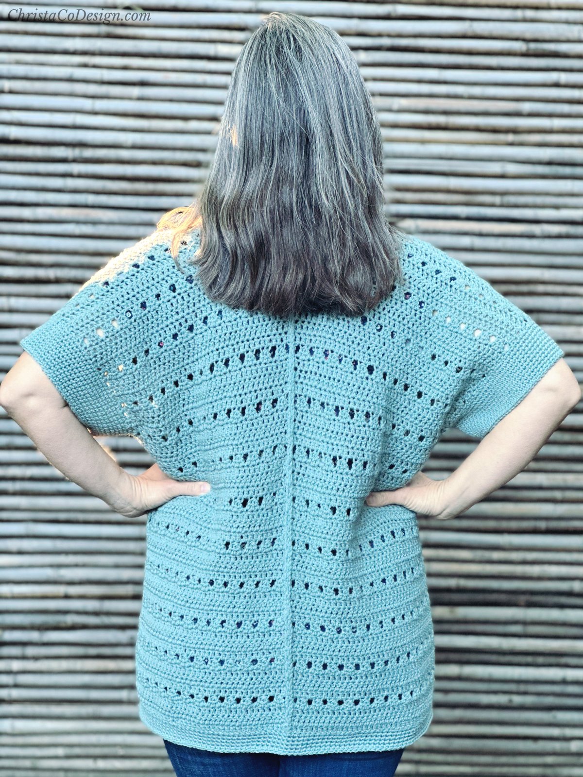 Back of crochet sweater with visible seam.