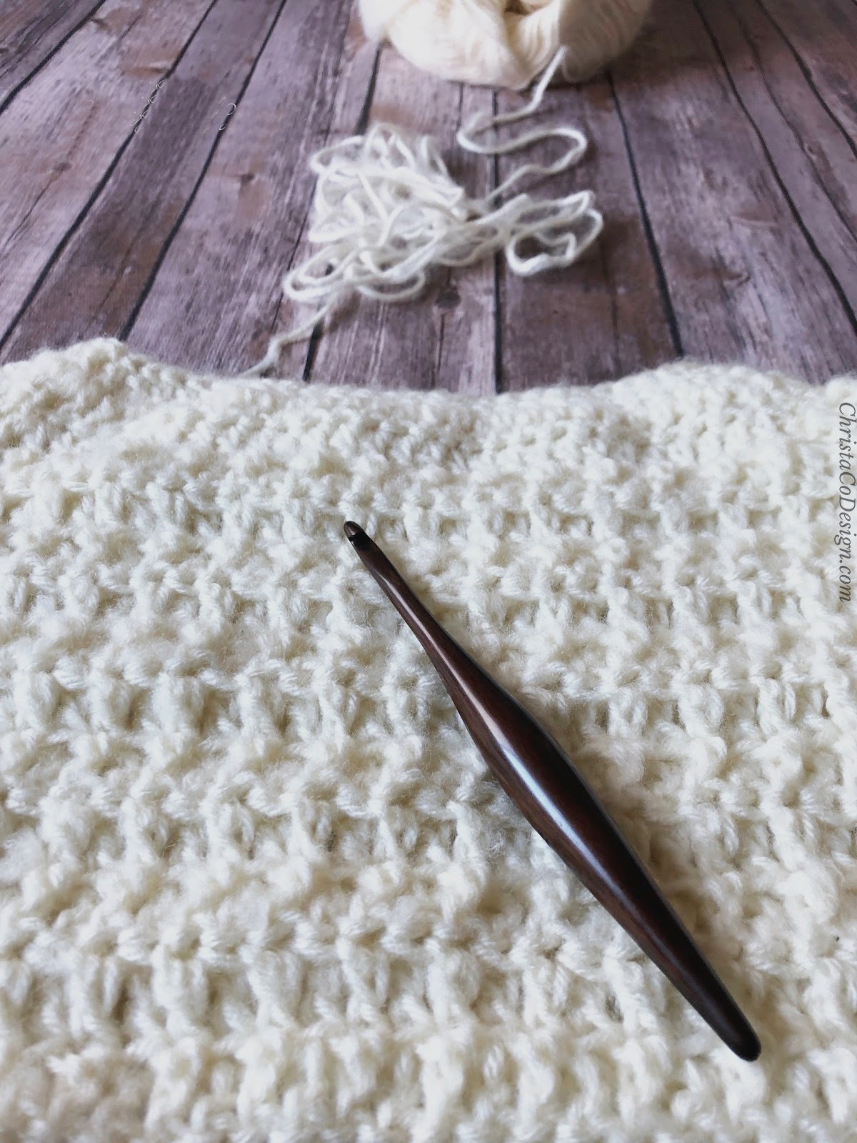 Work in progress of top down crochet sweater with wood hook.
