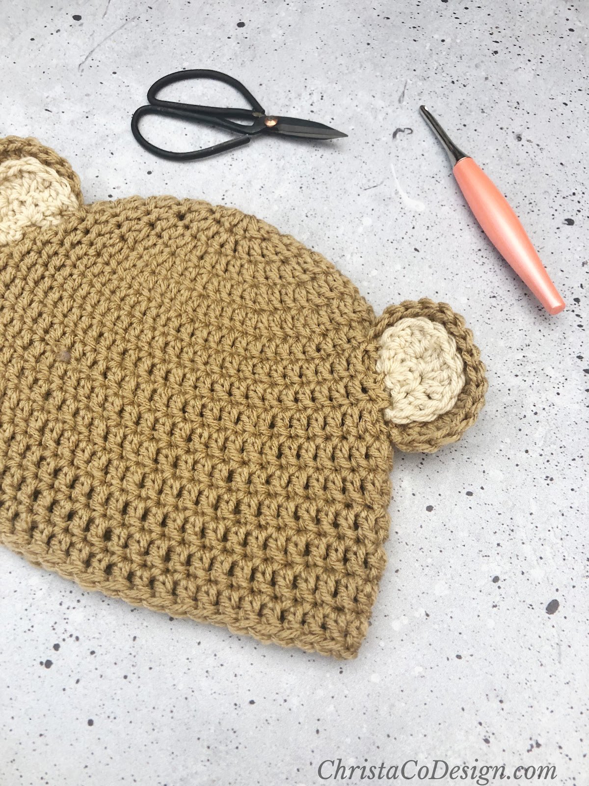 Brown crochet hat with bear ears. 