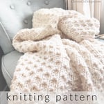 Cream white knit blanket on blue chair.