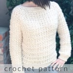 Woman in chunky cream crochet sweater.