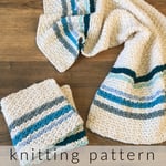 Folded washcloth next to striped towel with knitting pattern text.
