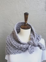 Purple knit neck warmer tied on mannequin.