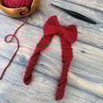 Red crochet Christmas bow.
