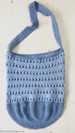 Top down view of flat crochet bag with treble stitches.