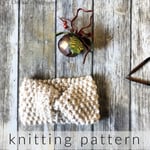 Knit earwarmer in seed stitch.