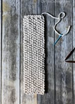 Flat rectangle knit in seed stitch.