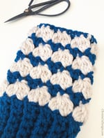 Close up of fingerless glove to show stitch texture.