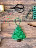 Green knit christmas hanging ornaments with notions.