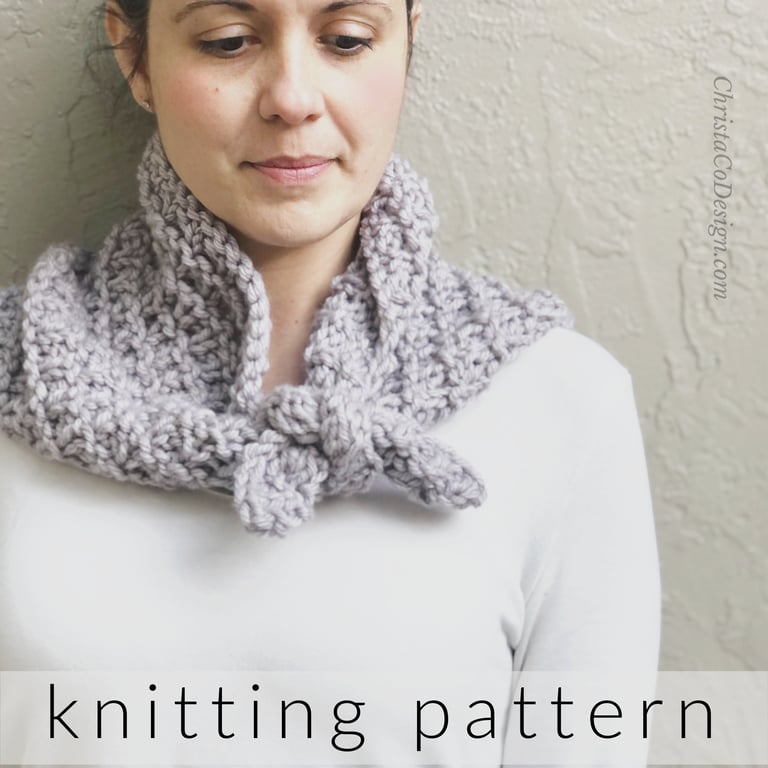 Woman with lavender knit neck warmer tied around neck. 